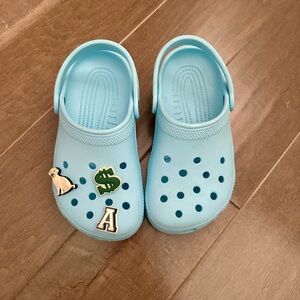 Big Kid Light Blue Crocs with Charms